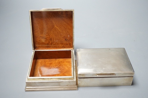 A George V silver mounted cigarette box, 11.5cm and a sterling cigarette box.